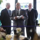 Governor-General Sir Anand Satyanand [middle] officially opens Habitat for Humanity's restore...