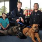 Grace Cotter (9, left), and Olivia Fowler (10) with Marjorie Orr,  of the  Otago SPCA, dogs Kudos...