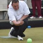Graham Hislop, of Kaitangata, in action during the Festival Fours at the Kaikorai green yesterday...