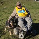 Grant Calder pats his dog Cramp after winning the South Island zigzag hunt championship at...