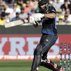Grant Elliott hits a six during the Cricket World Cup final match against Australia at the MCG....