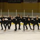 Grant Howie (centre) skates with the women of the New Zealand synchronised skating team at the...
