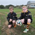 Grants Braes Football Club junior players Dylan Mitchell (8, left) and Connor Cooper (10) survey...