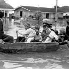 Grasmere  residents being rescued by rowing boat during Invercargill's big  flood of 1984.