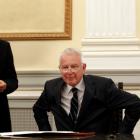 Greece's caretaker Prime Minister Panagiotis Pikrammenos (R) smiles during a swearing-in ceremony...