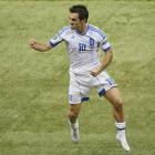 Greece's Giorgos Karagounis celebrates victory against Russia. REUTERS/Leonhard Foeger