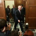 Greek Prime Minister George Papandreou leaves after an emergency cabinet meeting in the Greek...