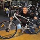Greg Leov of Bike Otago in Dunedin with a mountain bike converted into an electric bike in 2011....