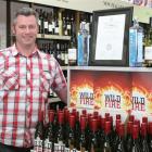 Greg Menzies, the general manager of Goodbrands.co.nz, in Betty's liquor store with a display of...