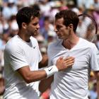 Grigor Dimitrov (L) speaks to Andy Murray after defeating him in their men's singles quarterfinal...