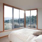 Concrete block, timber posts and raw beams feature throughout the 180 sq m house. Photos supplied.