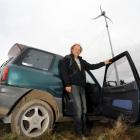 Hagen Bruggemann with his electric car and wind turbine, in Waitati yesterday. Photos by Peter...