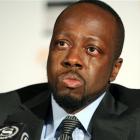 Haitian-born musician Wyclef Jean is overcome with emotion while discussing his recent visit to...