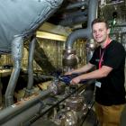 Hamish Lilley checks the engine room of  HMNZS Wellington during a recent  tour of the ship....