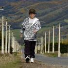 Harrison Kemp steps out on Maungatua Rd near Outram in preparation for his 10km trek in the area...