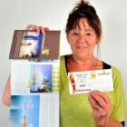 Hazel Davies with a glossy brochure and a scratch-and-win card, which turned out to be a scam....