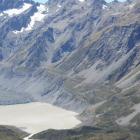 The glacial lake below the Hooker Glacier (centre left).  The glacier's retreat means the moraine...