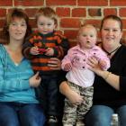 Heart Children clients (from left) Debbie Riley and Brady (19 months), Angela Evans and Lucas (2)...