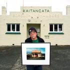 Helensville art historian and curator John Perry stands outside the old Kaitangata borough...
