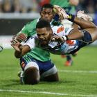 Henry Speight of the Brumbies drops the ball while attempting to score a try during the round 11...