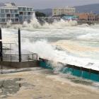High seas spill into St Clair salt water pool and crash against the sea wall at St Clair...