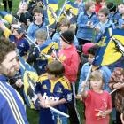 Highlanders captain Jamie Mackintosh with flag-waving young fans. Photos by Matt Stewart.