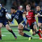 Highlanders centre Malakai Fekitoa makes a break against the Crusaders at Forsyth Barr Stadium in...