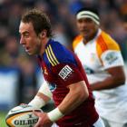 Highlanders halfback and captain Jimmy Cowan looks to make a break. Photo from Getty Images.