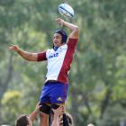 Highlanders No 8 Nasi Manu tries to haul in a lineout throw during training at Logan Park...