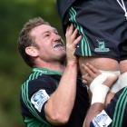 Highlanders prop Chris King lifts a team-mate at training at Logan Park this week. Photo by Peter...