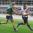 Highlanders winger Hosea Gear fends off the attention of Matt Faddes during training at Forsyth...