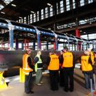 Hillside Engineering workshops' acting site manager Andy Bisset (second from left) shows media...