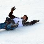 Hilton Scott,  of Frankton,  slides down the frozen course at the Queenstown Winter Festival dog...