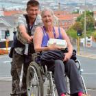 Horowhenua visitor Petrus Simonis pushes his mother up the hill to Moana Pool yesterday. Photo by...