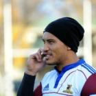 Hosea Gear talks on the phone after Highlanders training at Logan Park yesterday. Photo by Peter...