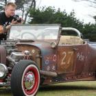 Hot rod enthusiast Colin Gale, of Dunedin, takes a photo of a '27 Roadster at Stateside Streeters...