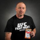 Howie Booth with his pass from the UFC fight night in Manila. PHOTO: CHRISTINE O'CONNOR