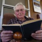 Hugh Morrison (85), of Mosgiel, reads his logbook from the period when he served as navigator in...