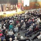 Hundreds of Rotarians listen to a group of individuals chosen to be sponsored on an international...
