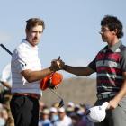 Hunter Mahan of the US celebrates after defeating Rory McIlroy (R) of Northern Ireland on the...