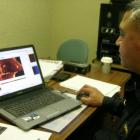 Hydrographic survey technician Warrant Officer Bernie Reihana looks at an item of interest in a...