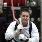 Ian Loan (42) pulls a 40m fire hose out as part of an open day at the Dunedin Fire Station on...