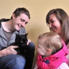 Ian, Naomi and Bethany (2) Simpson reunite with their cat, Riley, at the Otago SPCA haven on...