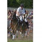 In this 2009 AP file photo, Prince Harry of Wales plays polo.