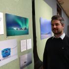 Sam Patterson, of Architecture and Design, Scotland, admires images of the British Antarctic...