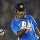 India captain Mahendra Singh Dhoni celebrates after his team beat England in their third one-day...