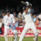 India's Rahul Dravid hits out as England wicketkeeper Matt Prior looks on during the fourth day...