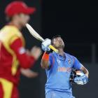 India's Raina celebrates scoring a century during their Cricket World Cup match against Zimbabwe...