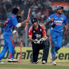 India's Virat Kohli (L) and Suresh Raina celebrate winning the match and series as England's...