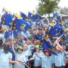 Injured Highlanders fullback Ben Smith is surrounded by hundreds of excited rugby fans at...